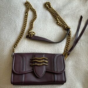 A rich purple cross body bag (worn twice)